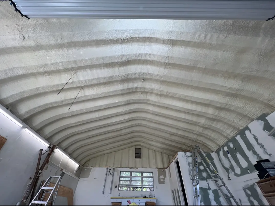 Spray polyurethane foam applied to the underside of a metal roof deck in Colorado Springs